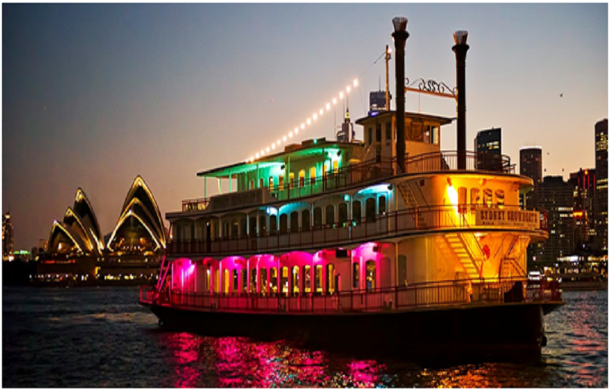 The Showboat paddlewheeler cruising on Sydney Harbour with the Opera House in the background  